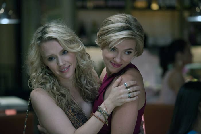 Kate McKinnon and Scarlett Johansson share a close hug