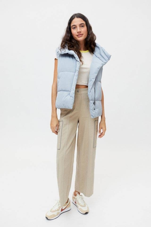 A model wearing the vest in slate
