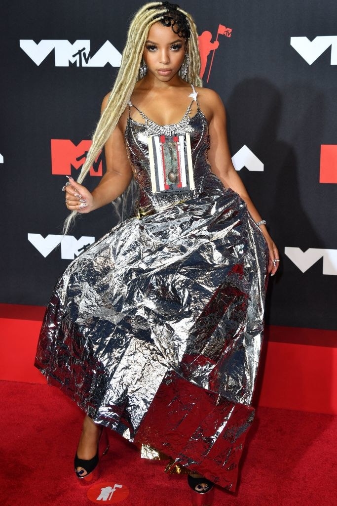 Chloe Bailey on the red carpet in a futuristic, crinkled silver gown