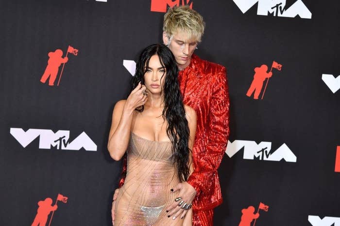 Megan Fox (L) and Us singer Machine Gun Kelly arrive for the 2021 MTV Video Music Awards