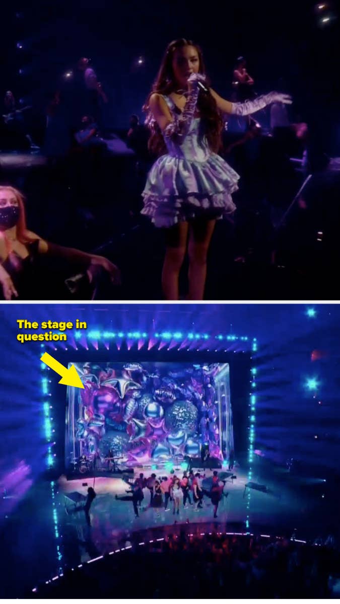 Arrow pointing to Olivia onstage with her background dancers