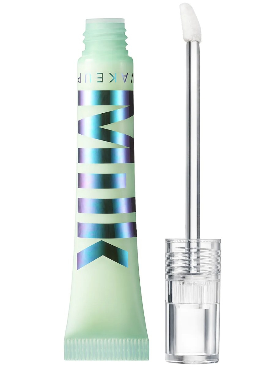 The pale green tube says &quot;MILK MAKEUP&quot; in purple and blue metallic coloring and a clear top and felt applicator