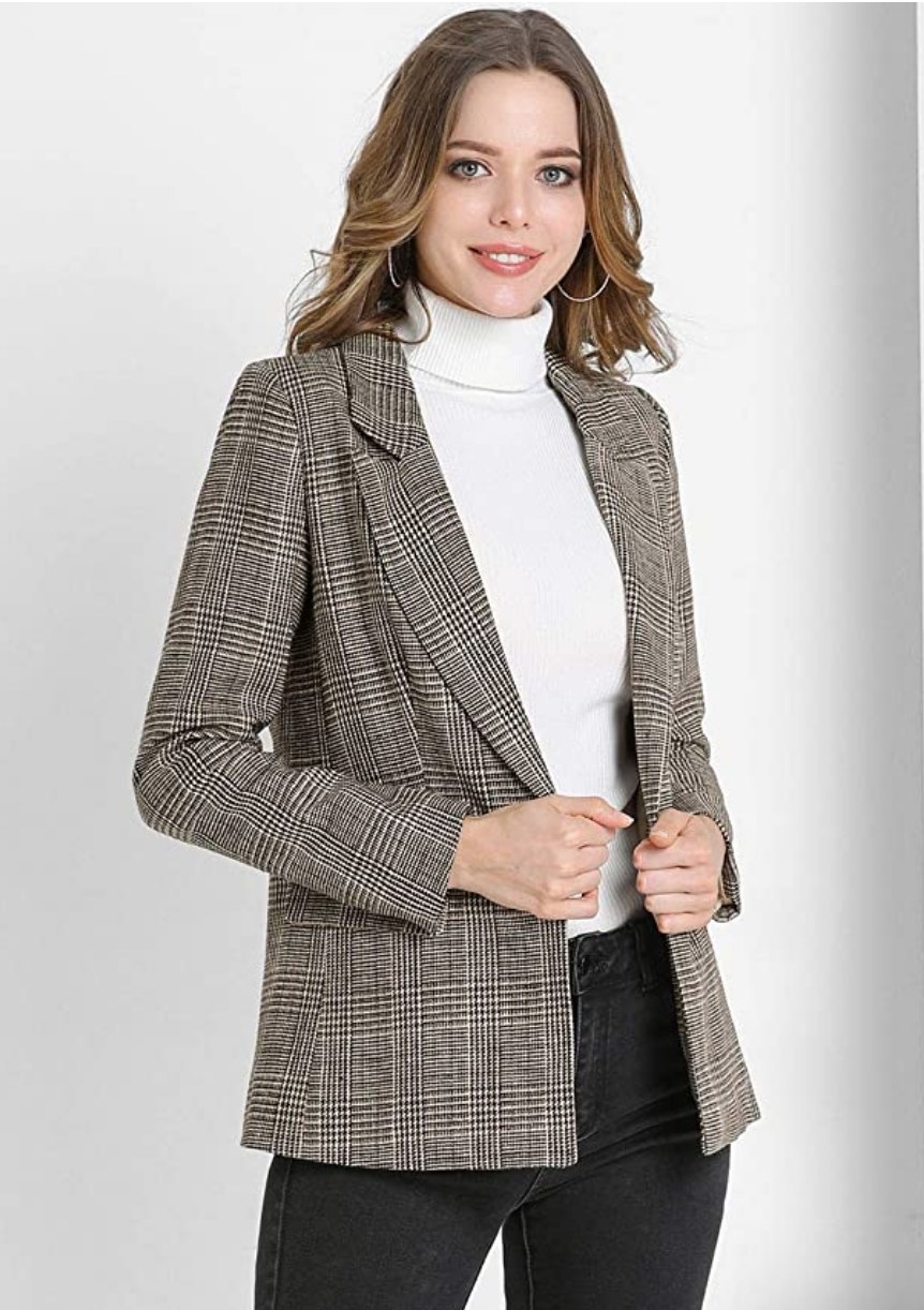 A model wearing a brown plaid blazer