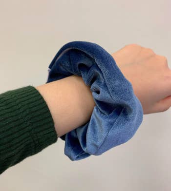 A customer review photo of the scrunchie on their wrist