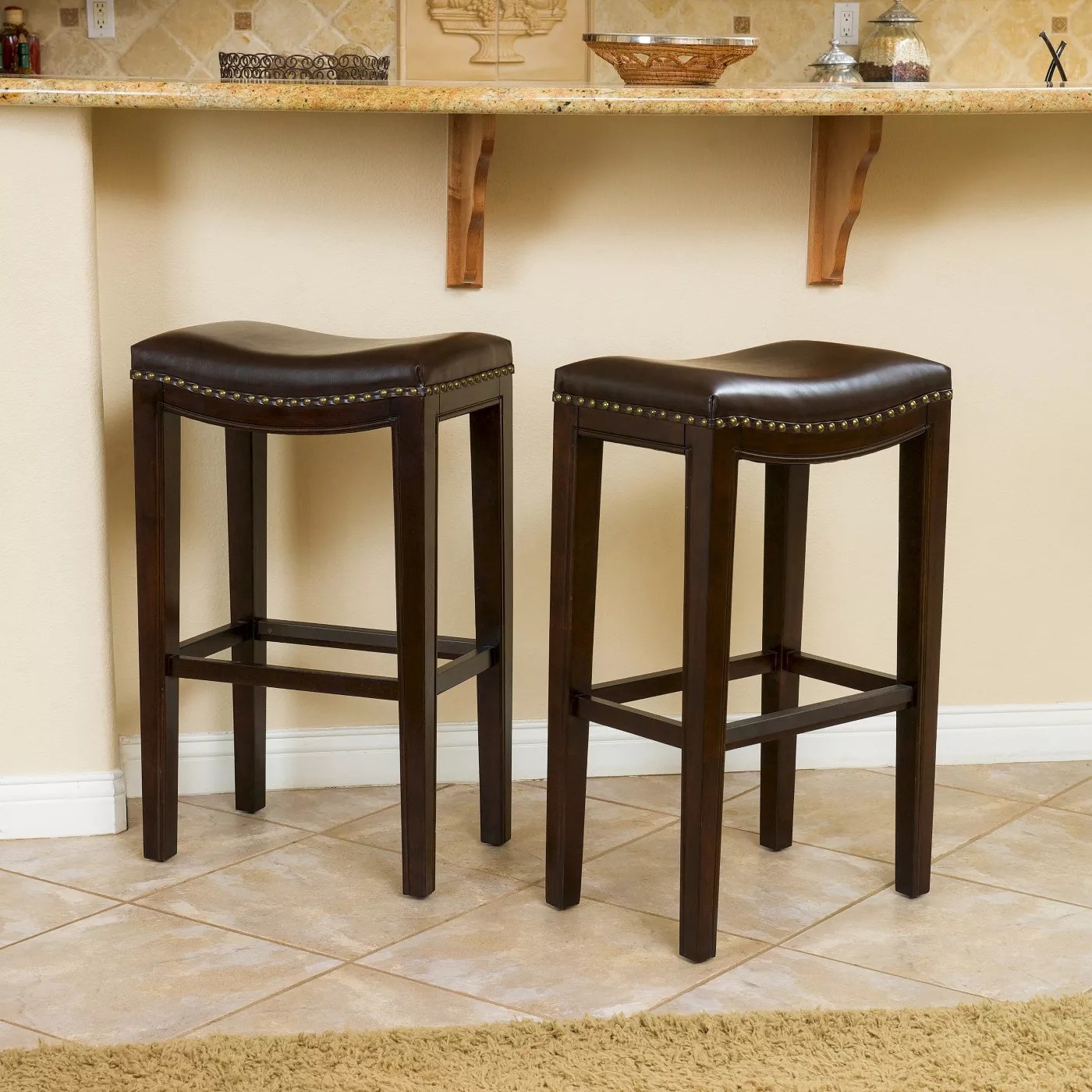 The backless, brown bar stools