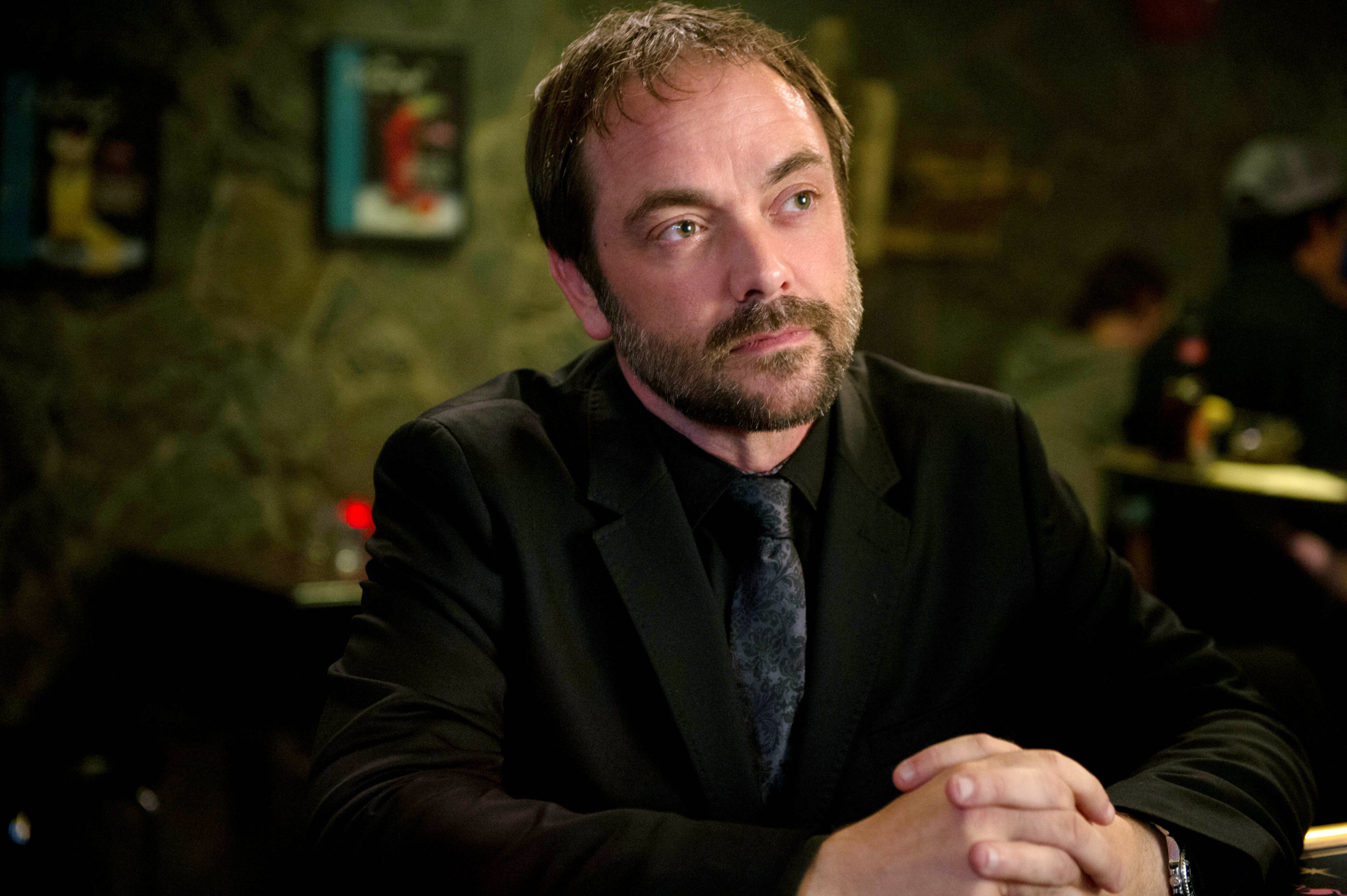 Crowley with his hands clasped