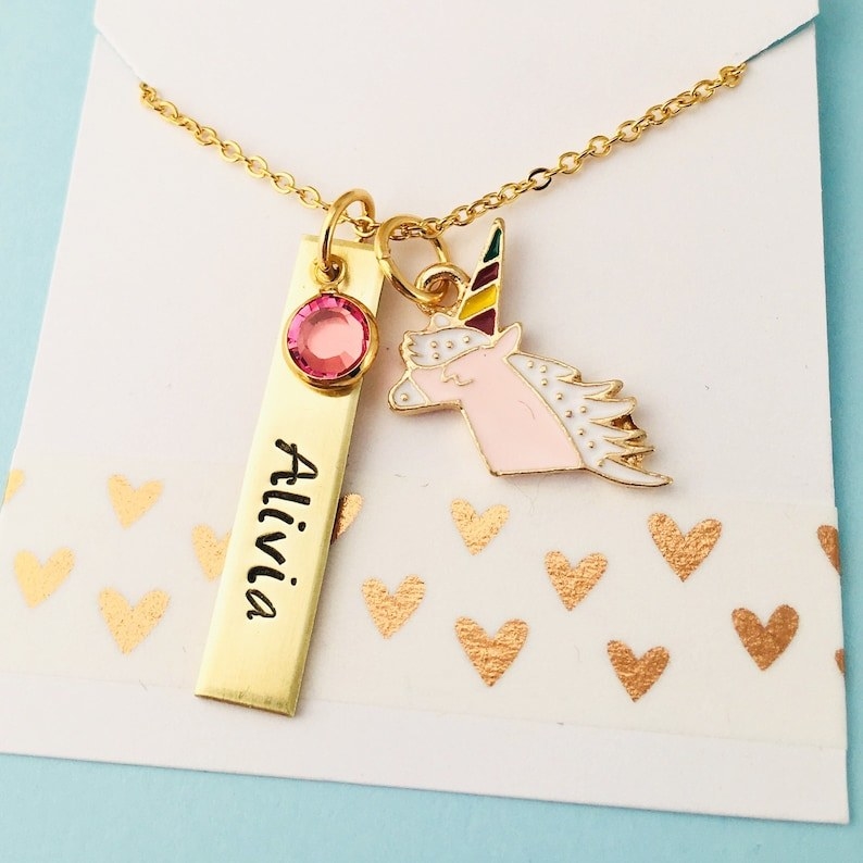 gold necklace with name charm, unicorn charm, and birthstone charm