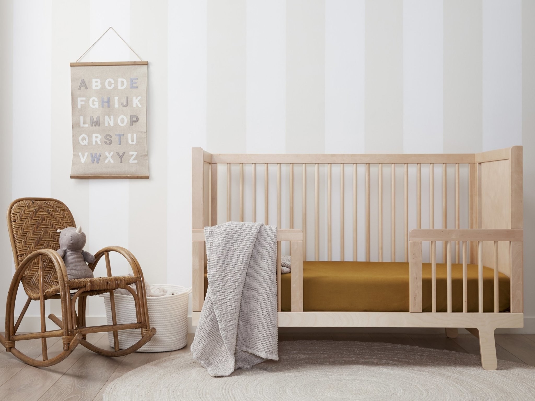 ochre colored sheets in a crib