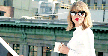 Taylor Swift with sunglasses and coffee