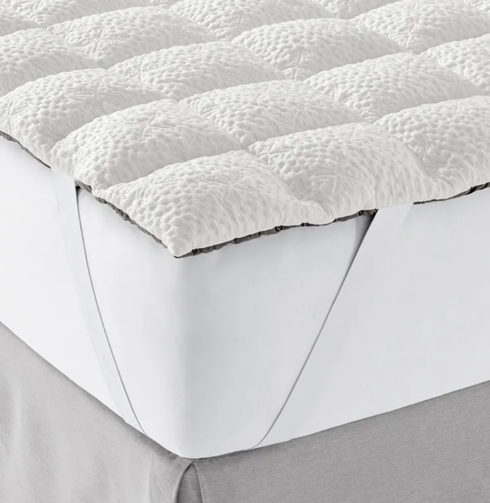 the mattress topper on a bed