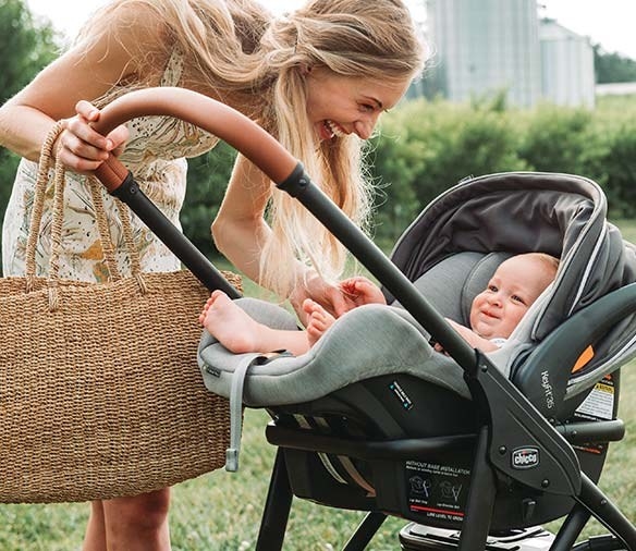 a baby in the car seat in a stroller