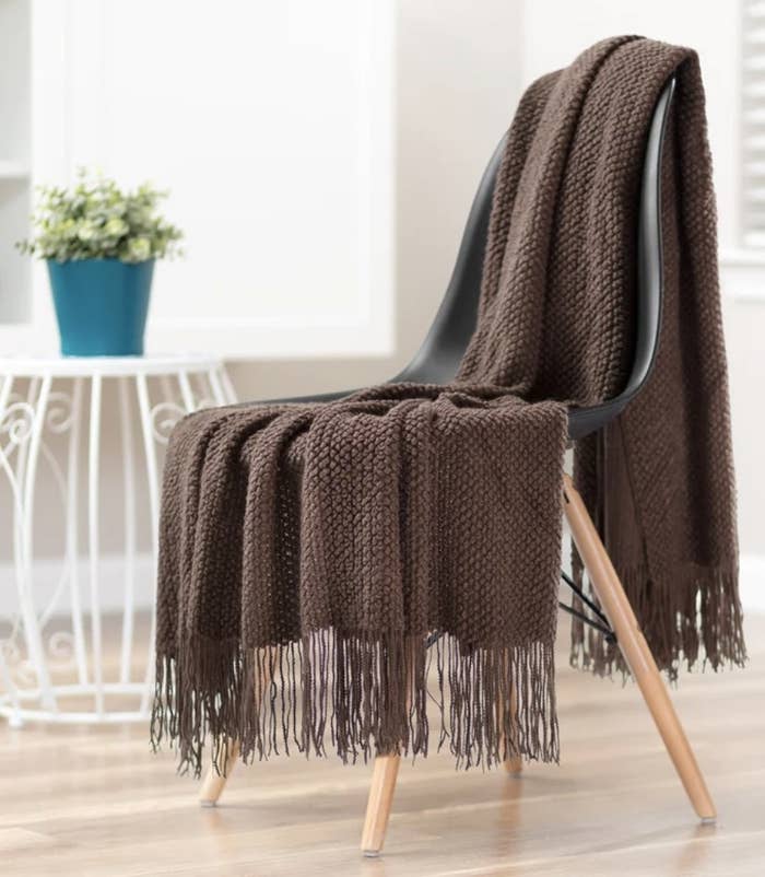 A brown throw blanket on a chair
