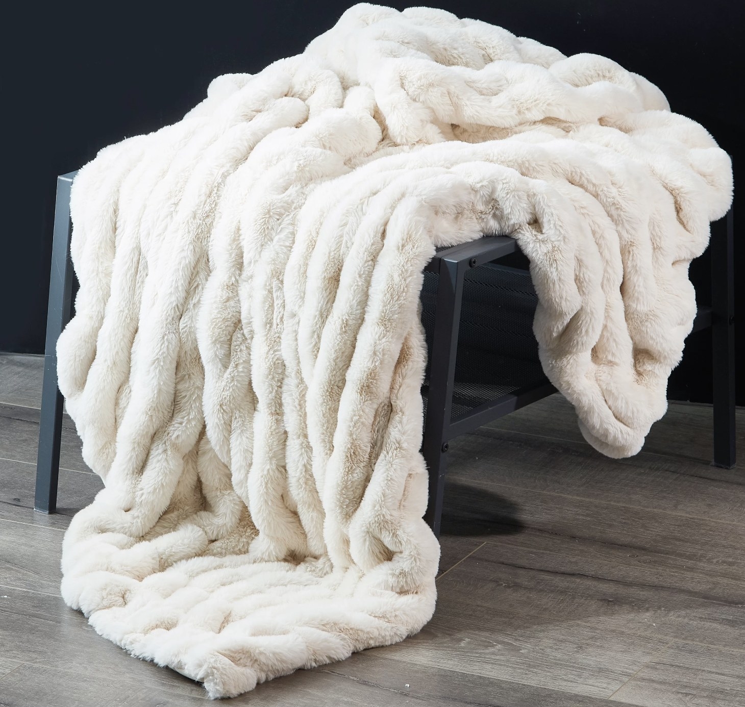 A white faux fur throw blanket