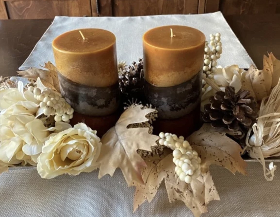 A reviewer photo of a set of scented pillar candles