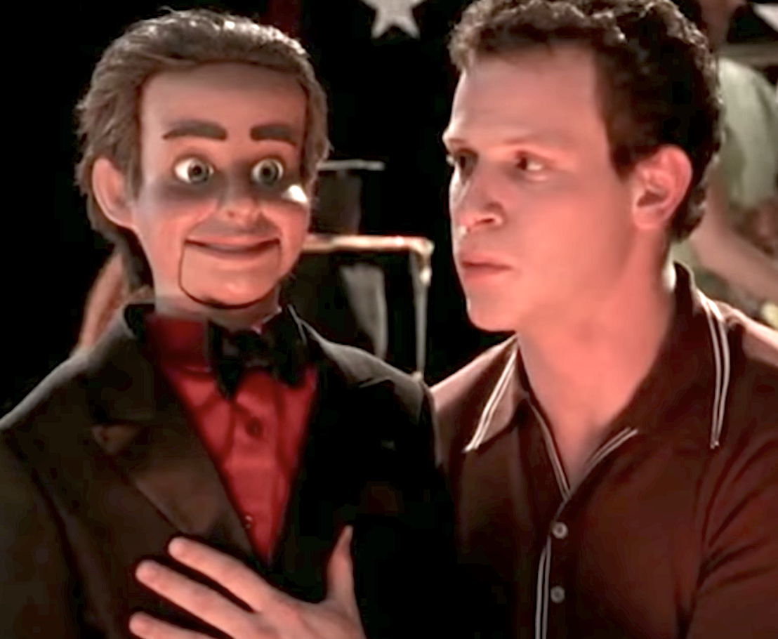 ventriloquist with dummy in suit