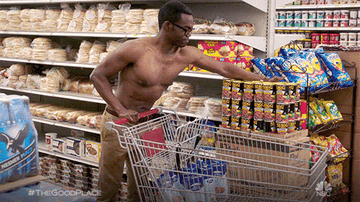 shirtless man loading items in cart gif