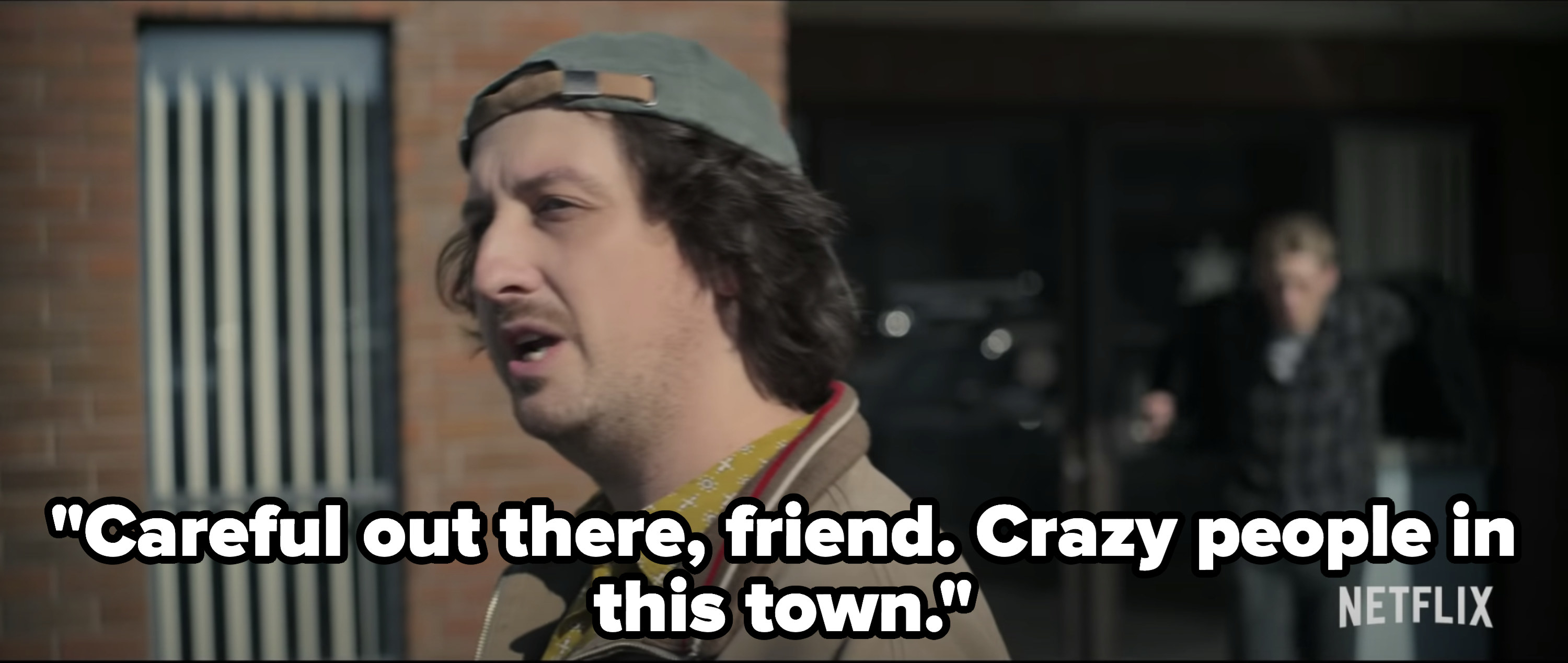 A man talking aloud to himself in front of the town police station