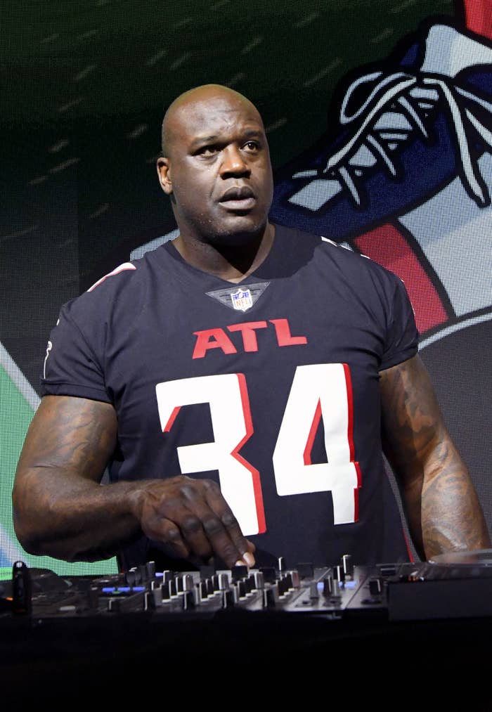 Shaq acting as a dj at an event