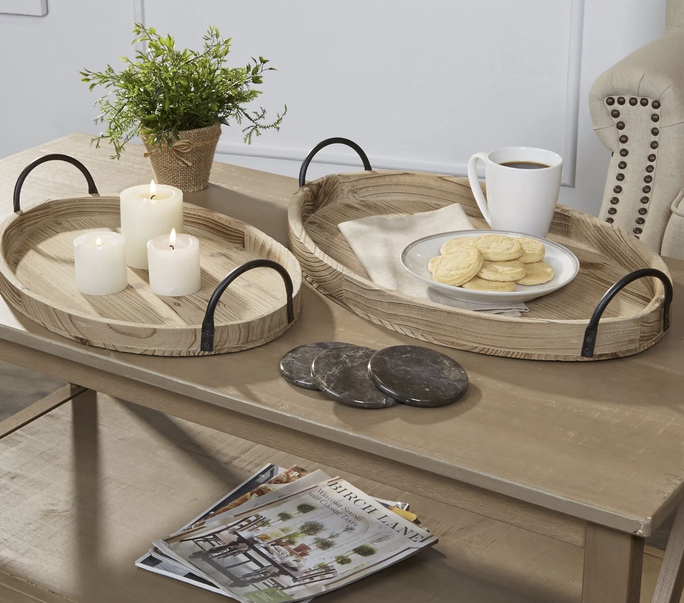 A set of two oval coffee table trays