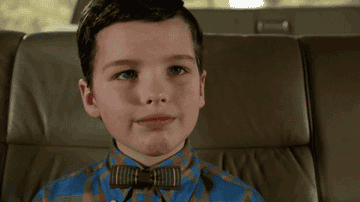 Sheldon from &quot;Young Sheldon&quot; adjusts his bow tie proudly.