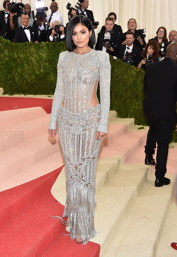 Kylie Jenner attends the &#x27;Manus x Machina: Fashion In An Age Of Technology&#x27; Costume Institute Gala in a a sparkly long-sleeved dress with see-through panels