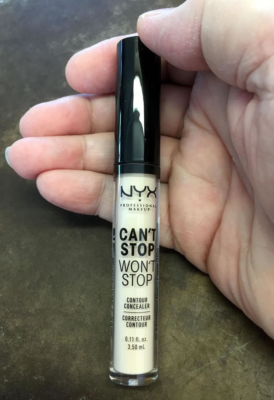 Reviewer holding the concealer