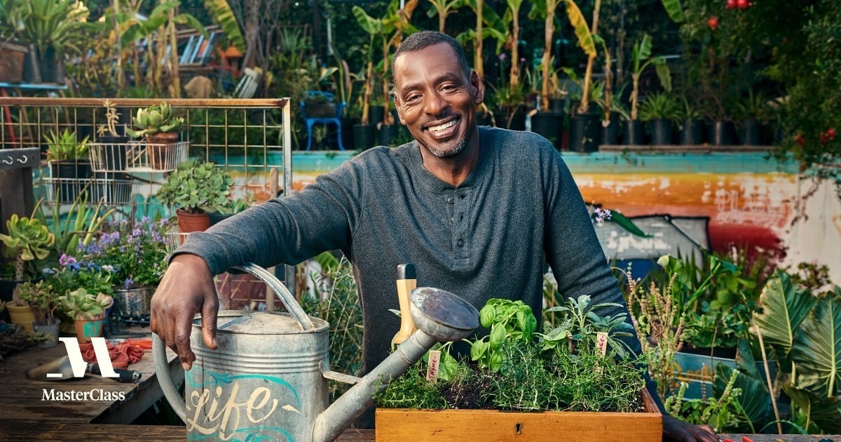 Ron Finley poses in his garden