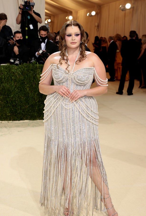 Barbie Ferreira attends The 2021 Met Gala in a sparkly beaded gown with fringe detailing at the bottom