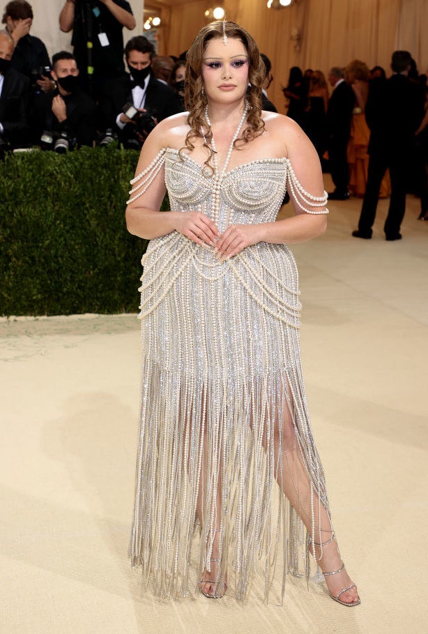 Barbie Ferreira attends The 2021 Met Gala in a sparkly beaded gown with fringe detailing at the bottom