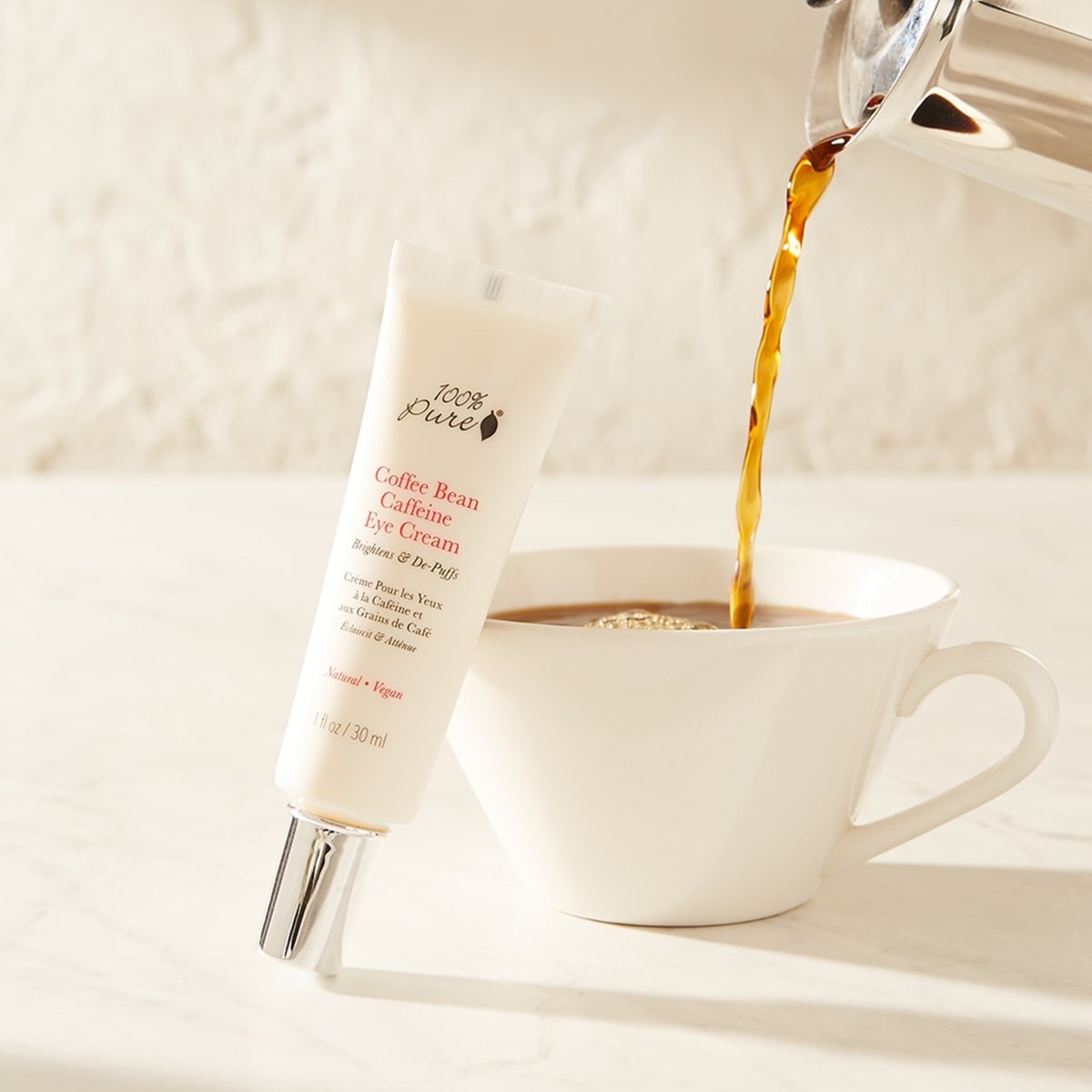 the eye cream with a cup of coffee