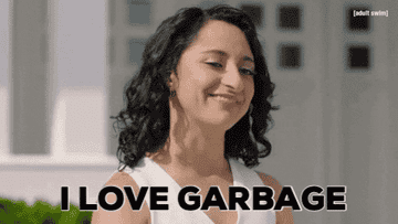 A woman smiling and cheerfully saying I love garbage