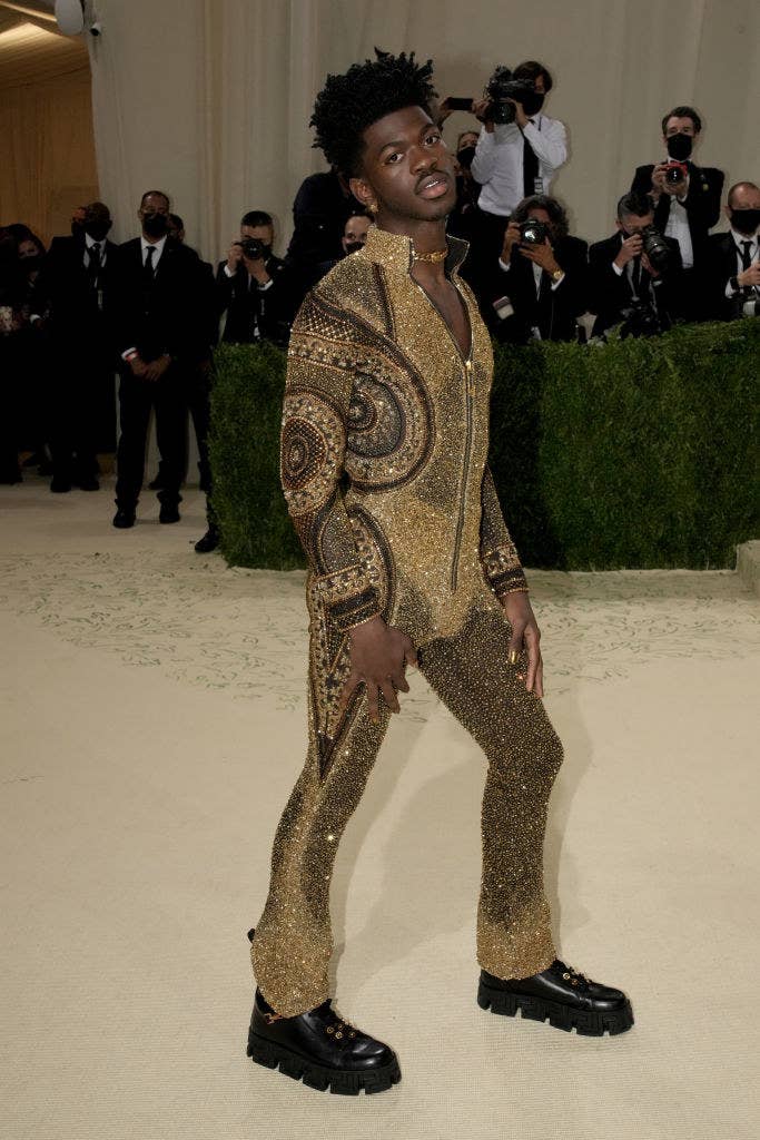 Lil Nas X wears a long sleeve glittery jumpsuit