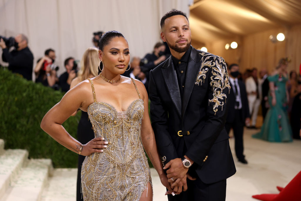 A close up of Stephen Curry and Ayesha Curry as they pose on the Met Gala red carpet