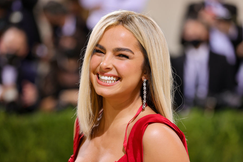 A close up of Addison Rae as she smiles brightly