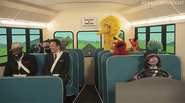 A bus full of people and &quot;Sesame Street&quot; characters