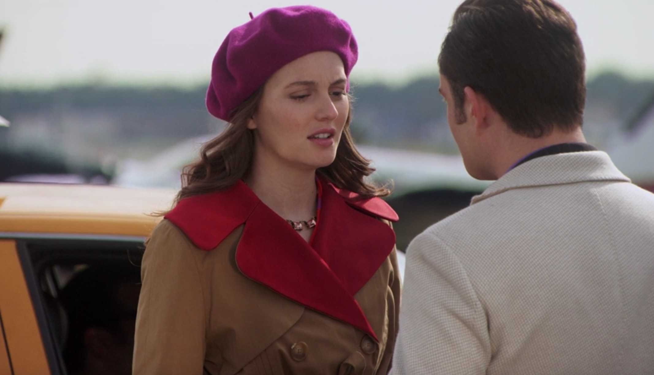 Blair Waldorf (original series) wearing a brown trenchcoat.