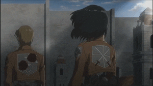 Mikasa Ackerman turns around her hair blowing in the wind