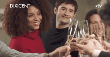 gif from call my agent - characters  clinking champagne glasses