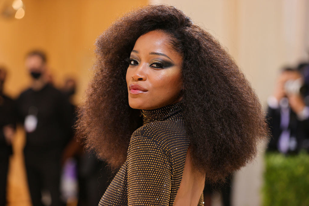 A close up of Keke Palmer as she shows off her dark eye makeup