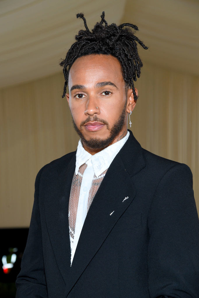 A close up of Lewis Hamilton as he poses on the steps of the Met