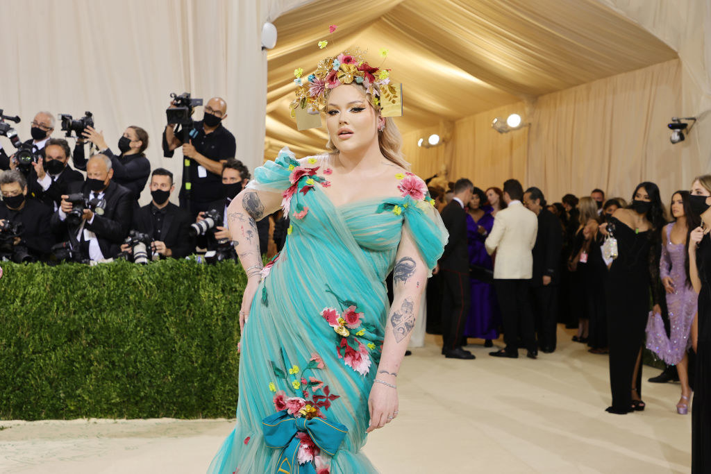 Nikkie de Jager leans towards the side with her hand on her hip as she poses on the Met Gala red carpet