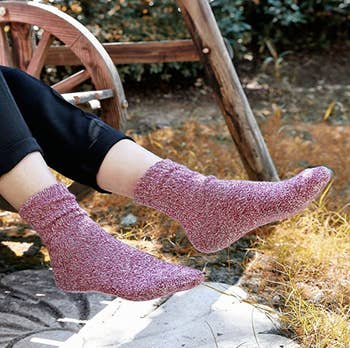 Model wearing pink thick socks 