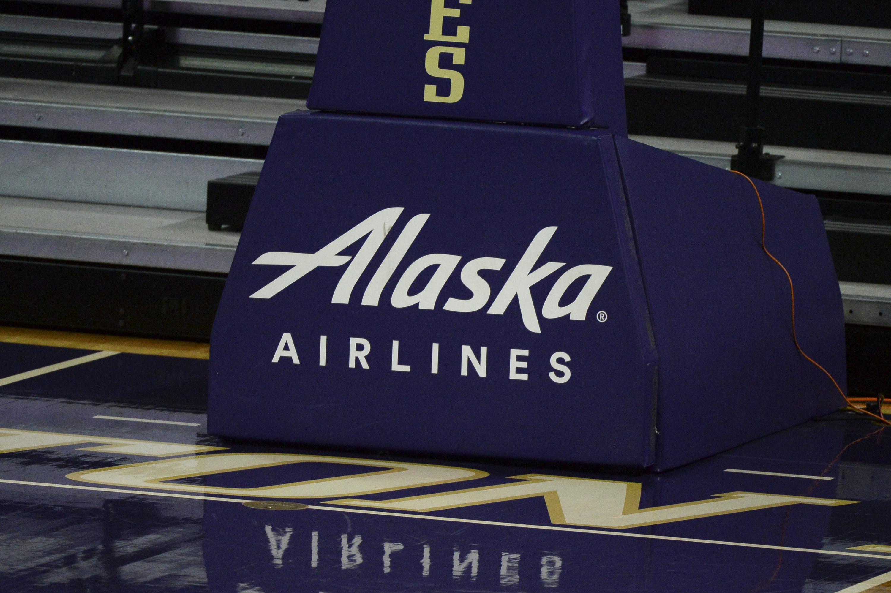 An Alaska Airlines logo on a basketball court