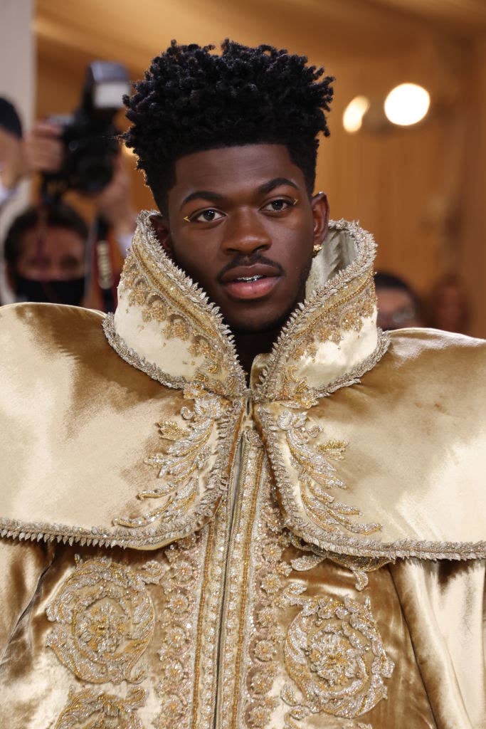 Lil Nas X in a printed cape