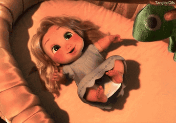 a gif of baby rapunzel smiling