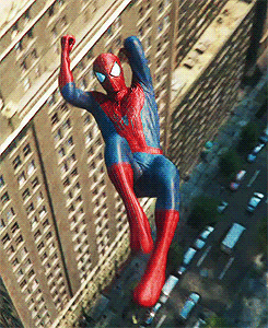Spider-Man swinging from tall buildings