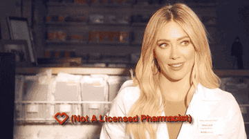 Hilary Duff in a lab coat with the caption &quot;not a licensed pharmacist&quot;