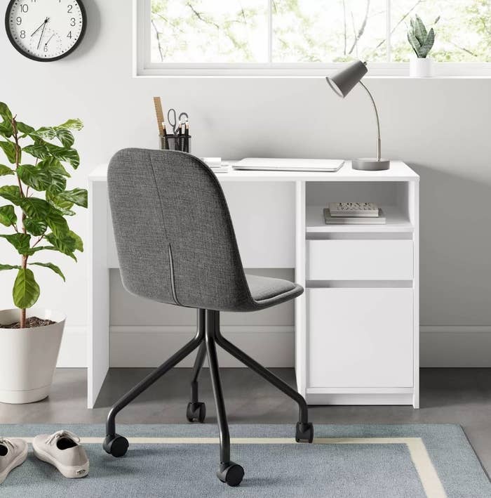 White desk with gray desk chair in front