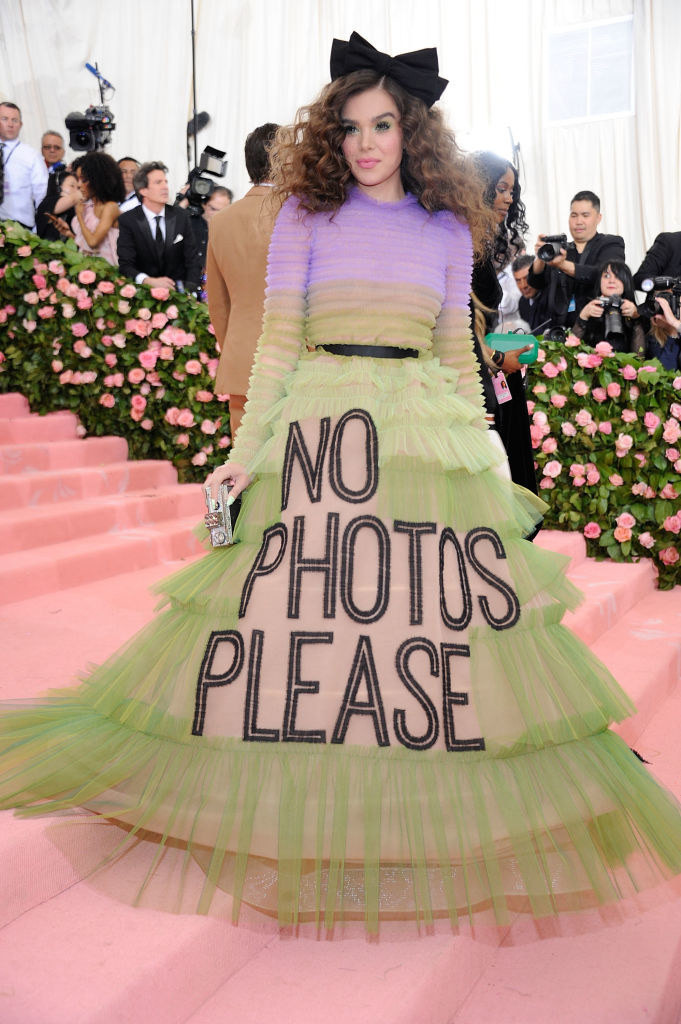 Hailee wore a multicolored tiered ball gown with the words &quot;No photos please&quot; embroidered across the front