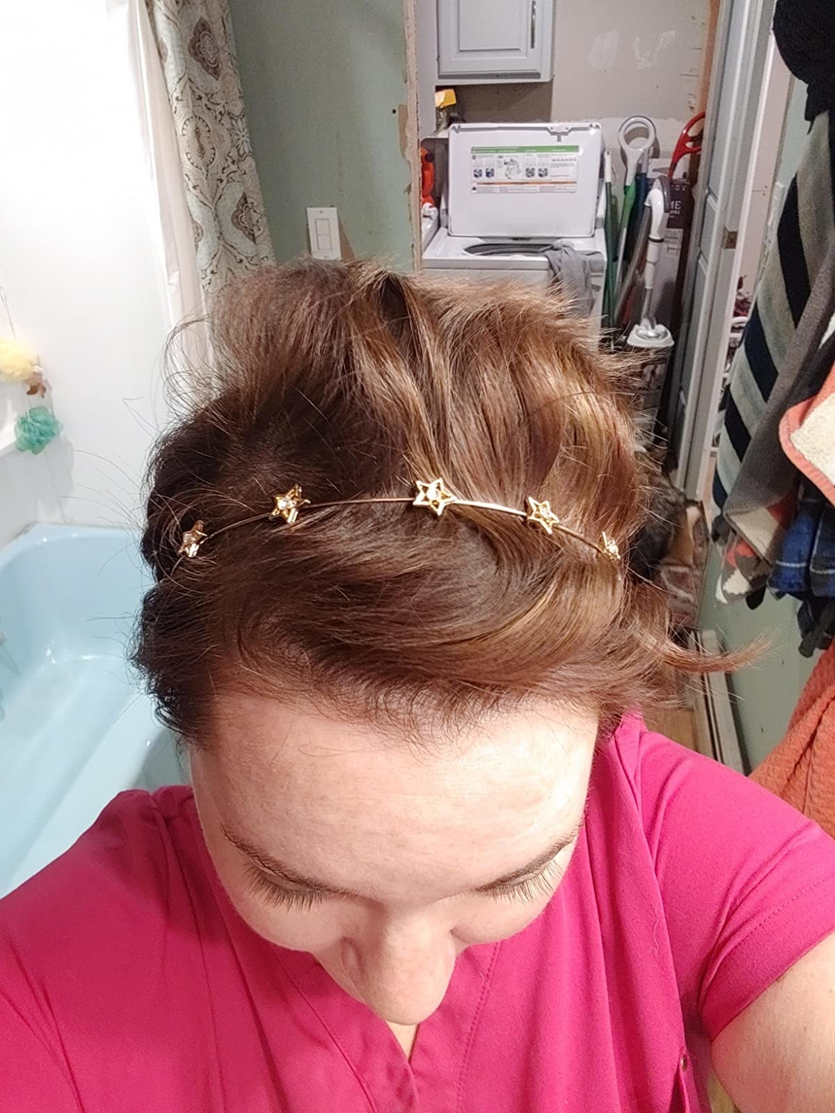 Reviewer wearing a dainty metal headband with stars on it
